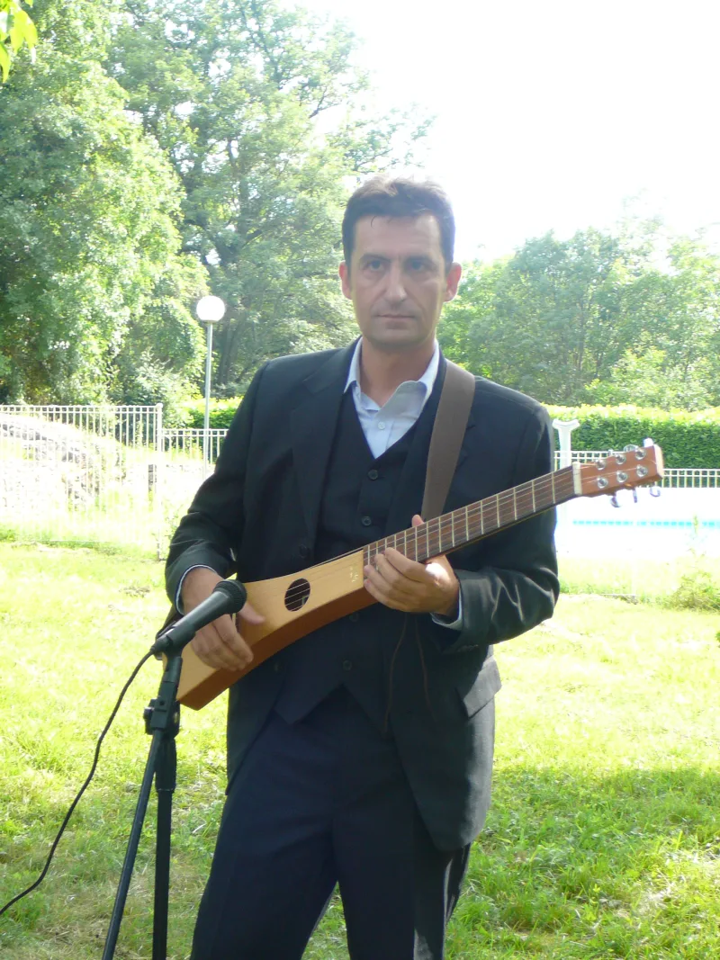Serge Serna with a Martin travel guitar